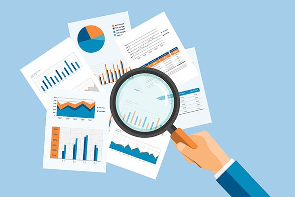 cartoon hand holding magnifying glass hovering over documents