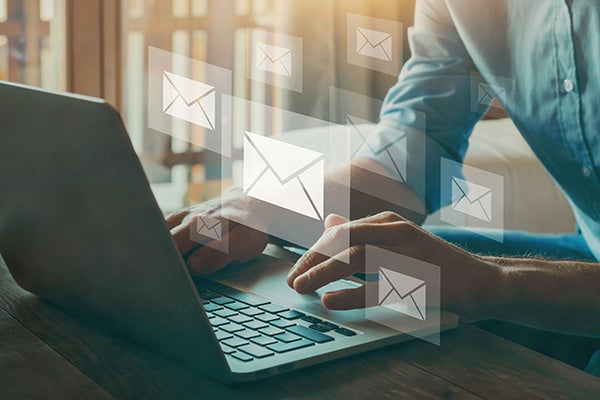 Man emailing at his laptop