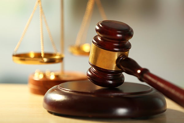 A judges gavel and scales of justice.