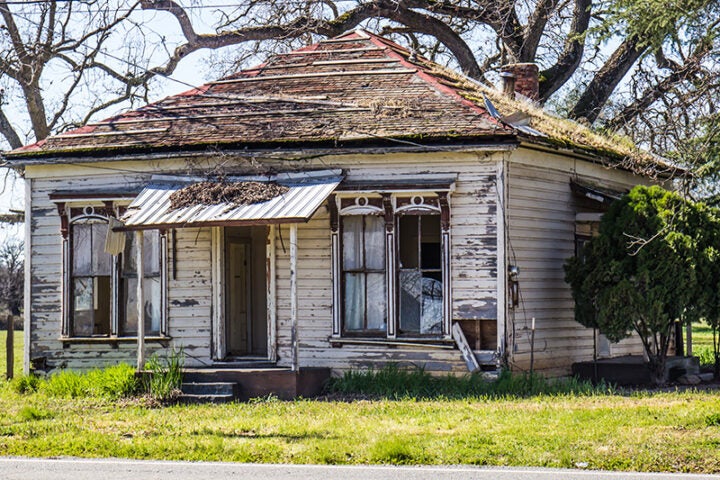peeling paint on run down abandoned home