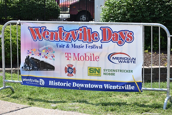 alt= A banner that says Wentzville Days Fair and Music Festival Historic Downtown Wentzville with other logos on it.