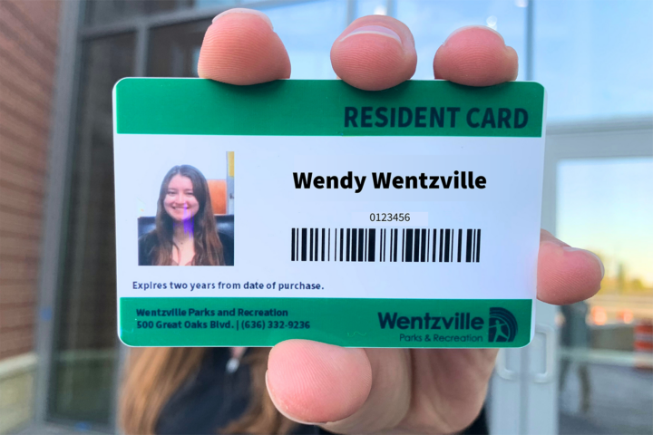woman holding her resident card
