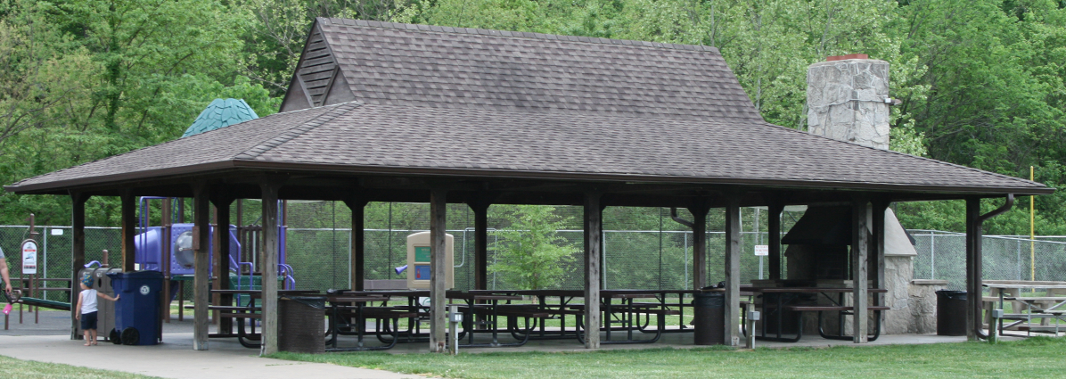 park pavillion with fireplace and covered picnic tables