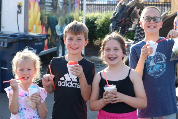Two boys and two girls eating snow cones at Wentzville Days