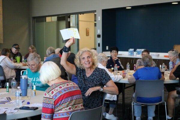 woman raising her hand