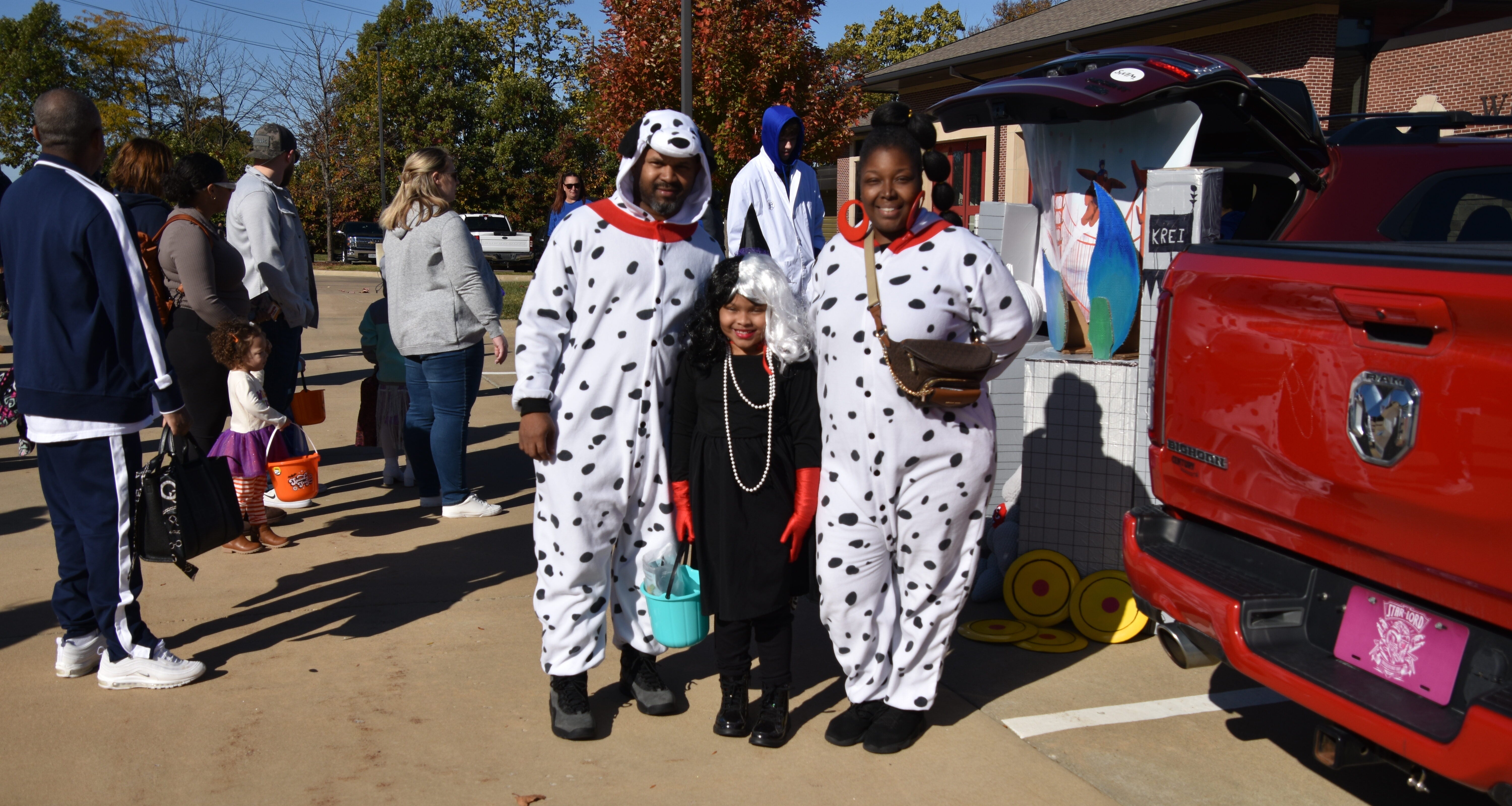 family dressed as Dalmatians and Cruella