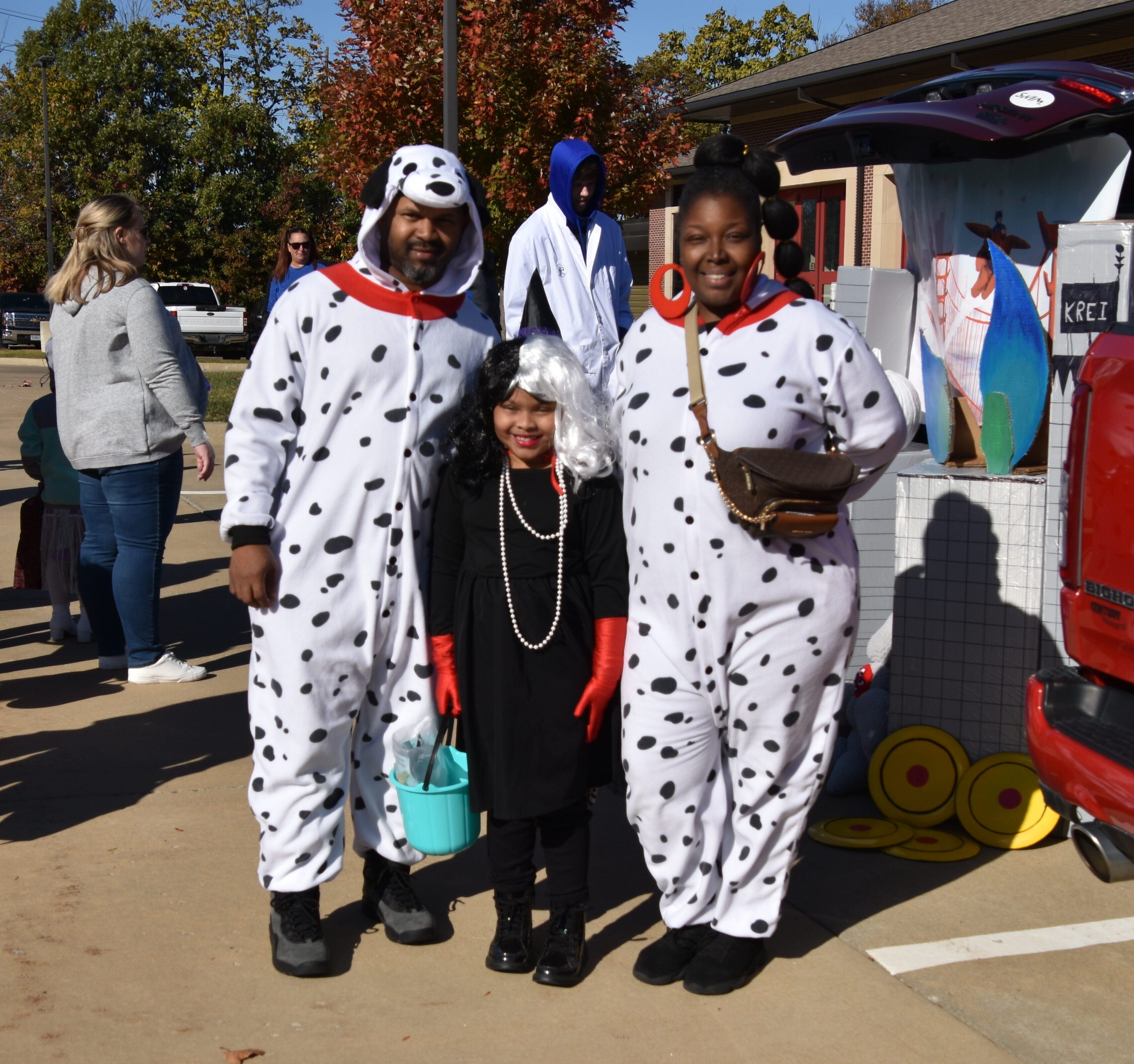 family dressed as Dalmatians and Cruella