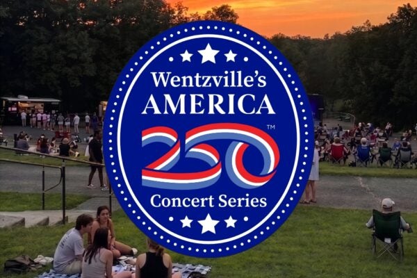 America 250 Concert Series Logo on an image of a crowd of people watching an outdoor concert