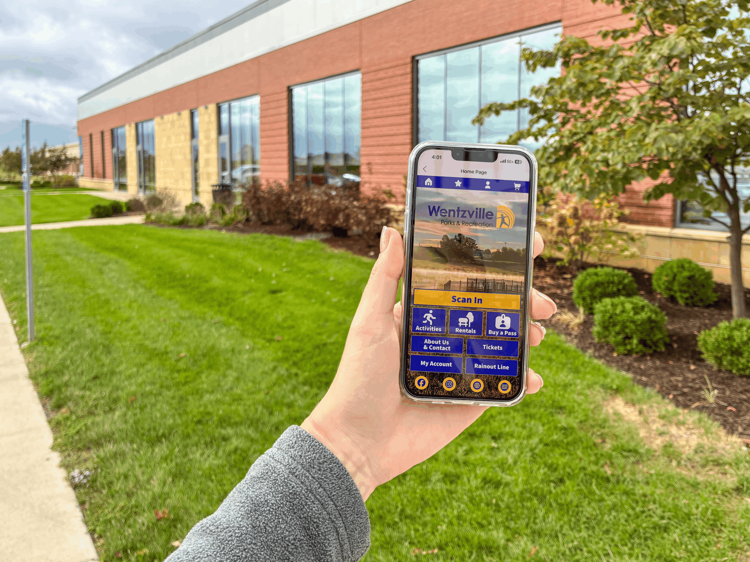 hand holding smartphone showing Wentzville Parks app