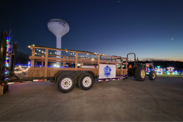 hayride trailer on the road during holiday light display