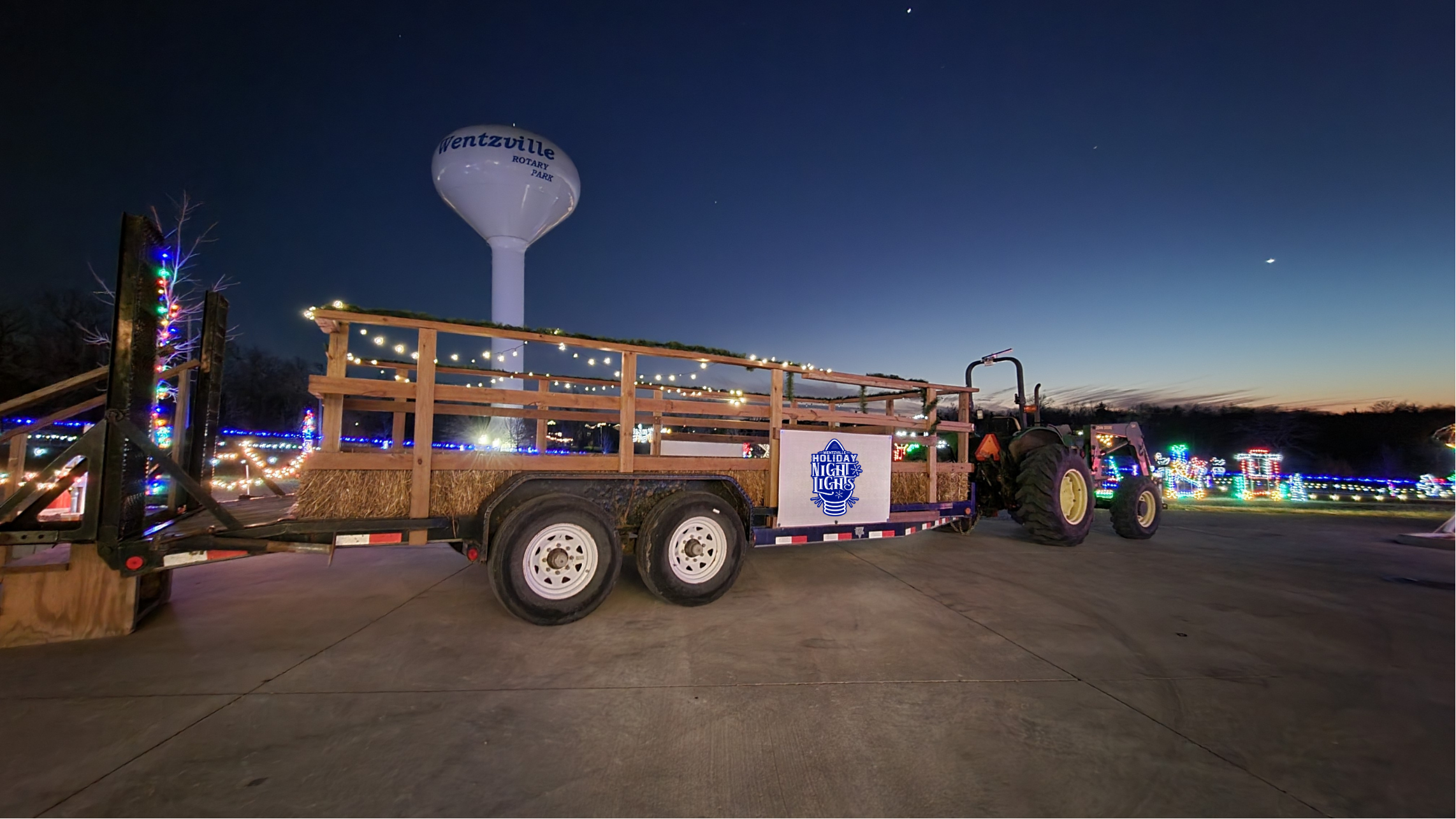 hayride trailer on the road during holiday light display